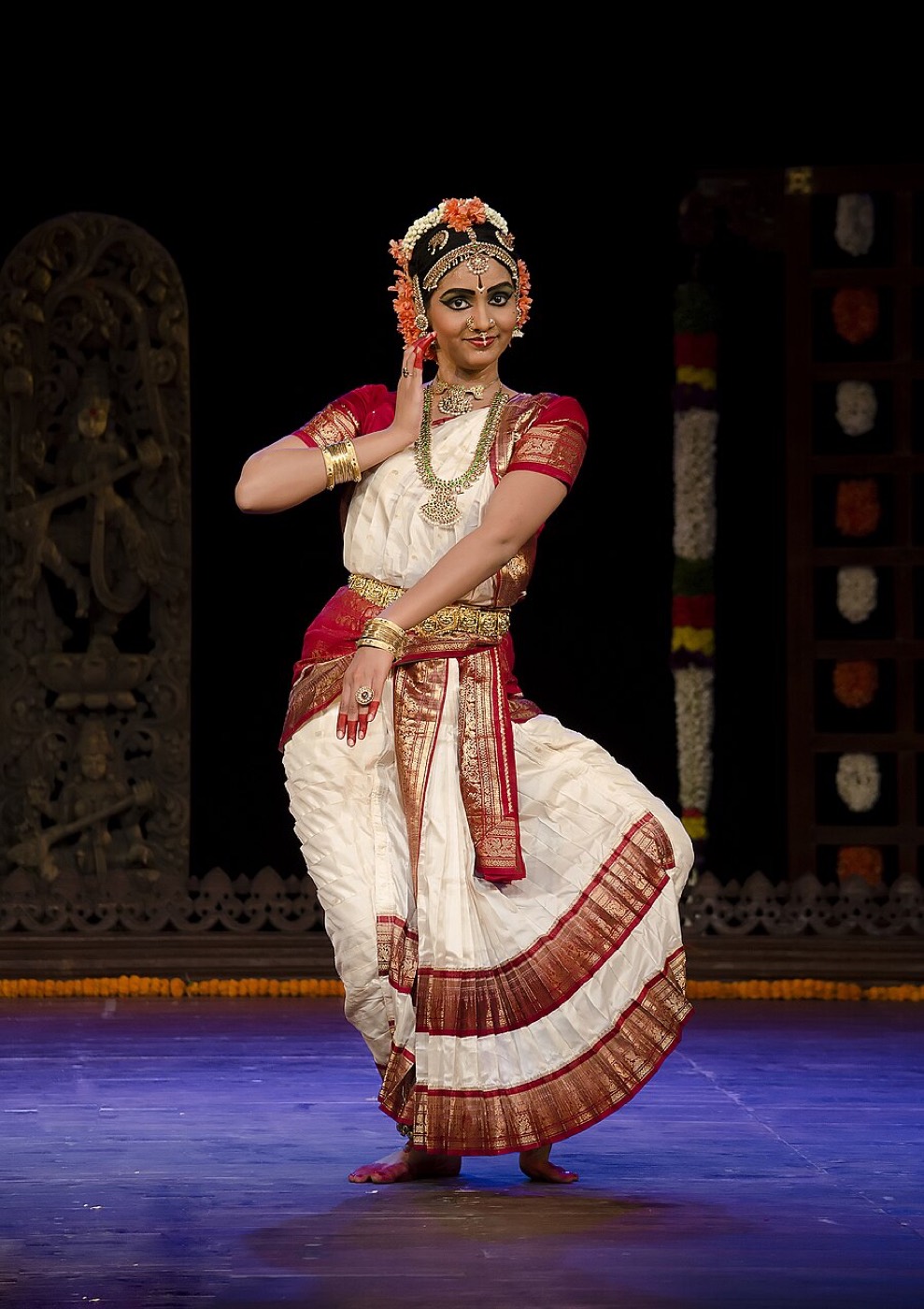Kuchipudi performer in traditional costume on stage